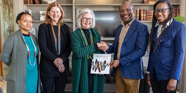 L_R Dr Furahini Tluway, DVC Research Prof Lynn Morris, Prof Michele Ramsay, VC Prof Zeblon Vilakazi, Jocyelyn Gayenga at the AWI Gen memoir handover 600x300